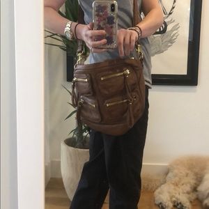 Linea Pelle tan leather messenger shoulder bag.